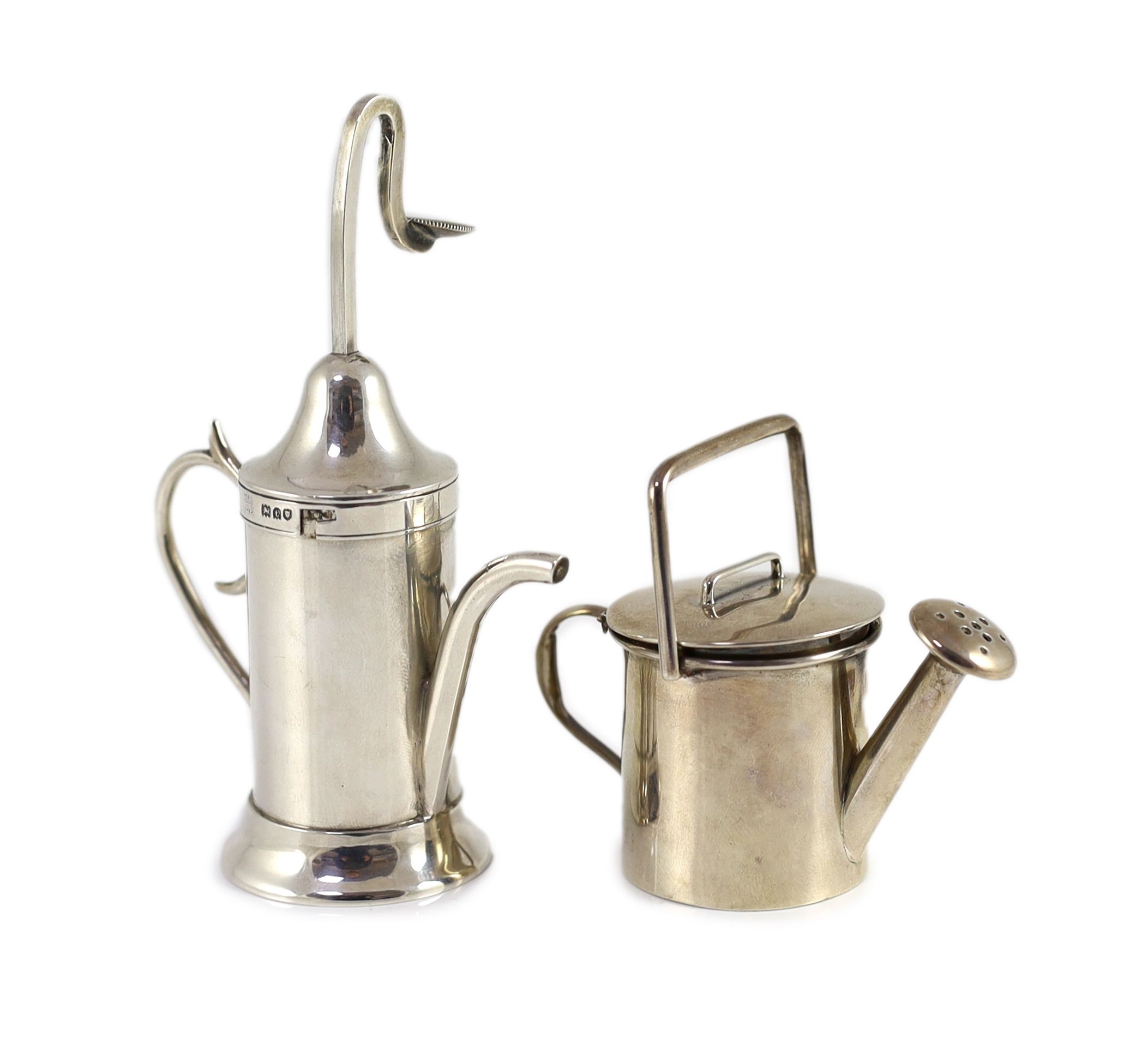 A George V silver novelty atomiser modelled as a pouring vessel, London, 1914, 12.3cm and a novelty silver compact?